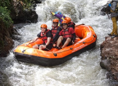 man-blue-shirt-is-riding-raft-with-blue-life-jacket